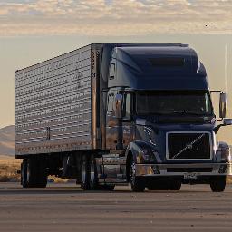 black truck on road during daytime